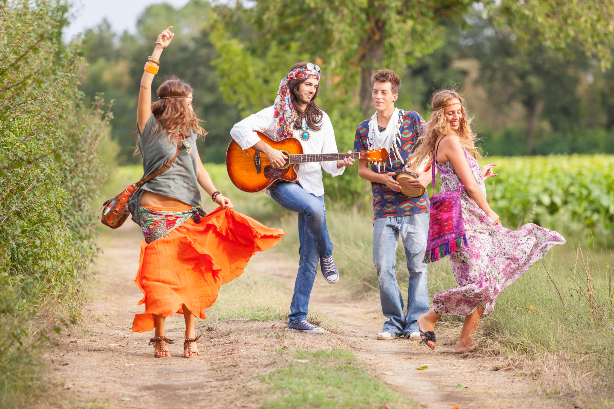 Hippie,Group,Playing,Music,And,Dancing,Outside