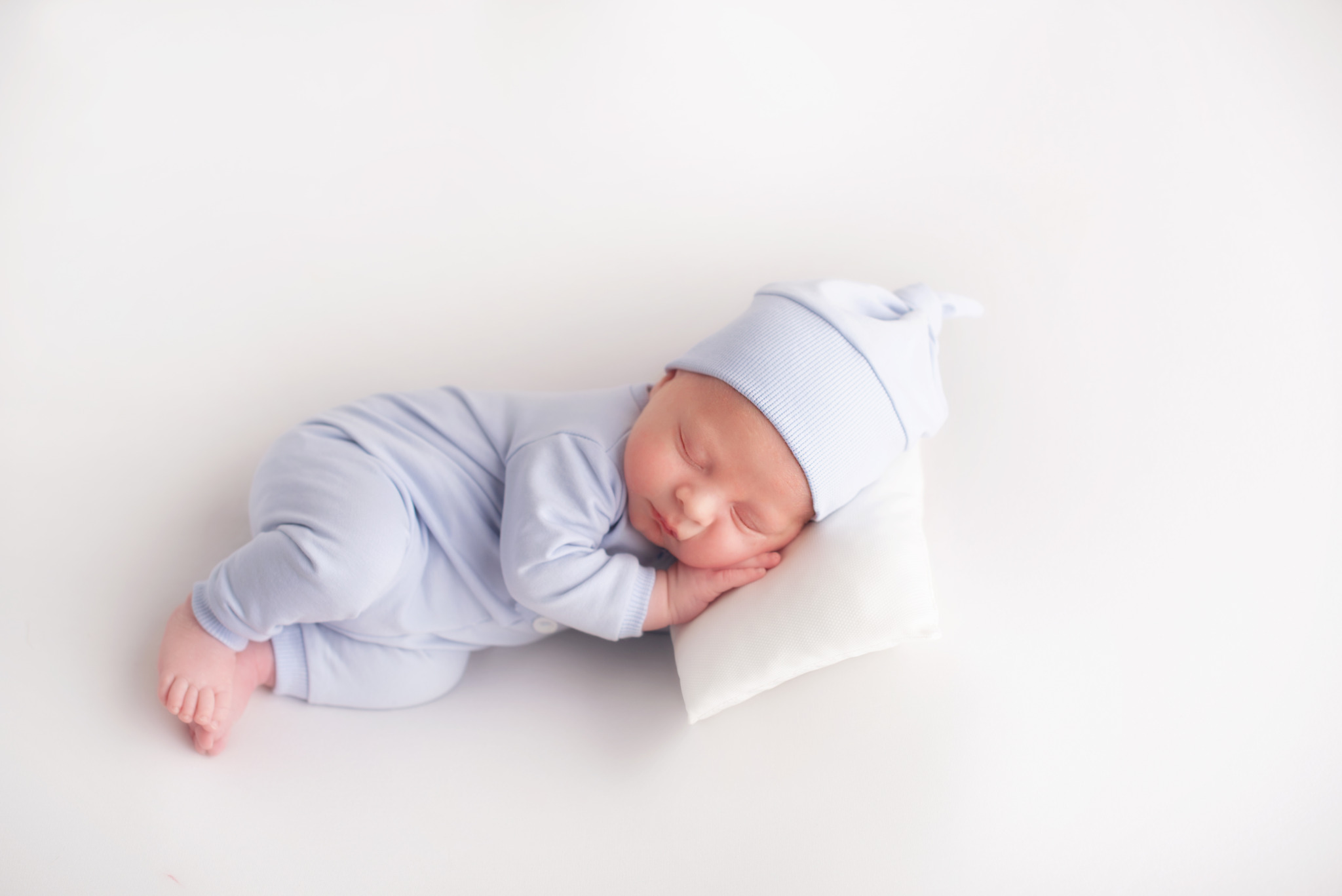Lovely,Newborn,Resting,On,Pillow.,Sleeping,Newborn,Baby,Boy