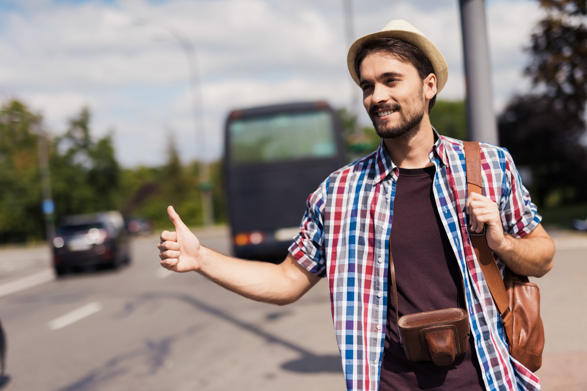 hitchhiker-catches-car-man-travels-with-camera